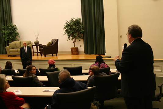Dr. Billy Morehead, Chair of the Division of Accountancy at Delta State University (foreground, right), poses a question for Norman R. Augustine (standing), guest lecturer for the Delta State College of Business Annual Guest Lecture Series.  